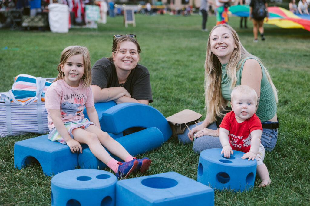 people playing with huge blocks