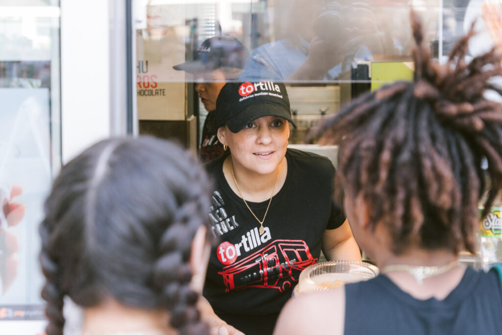 people ordering at a food truck