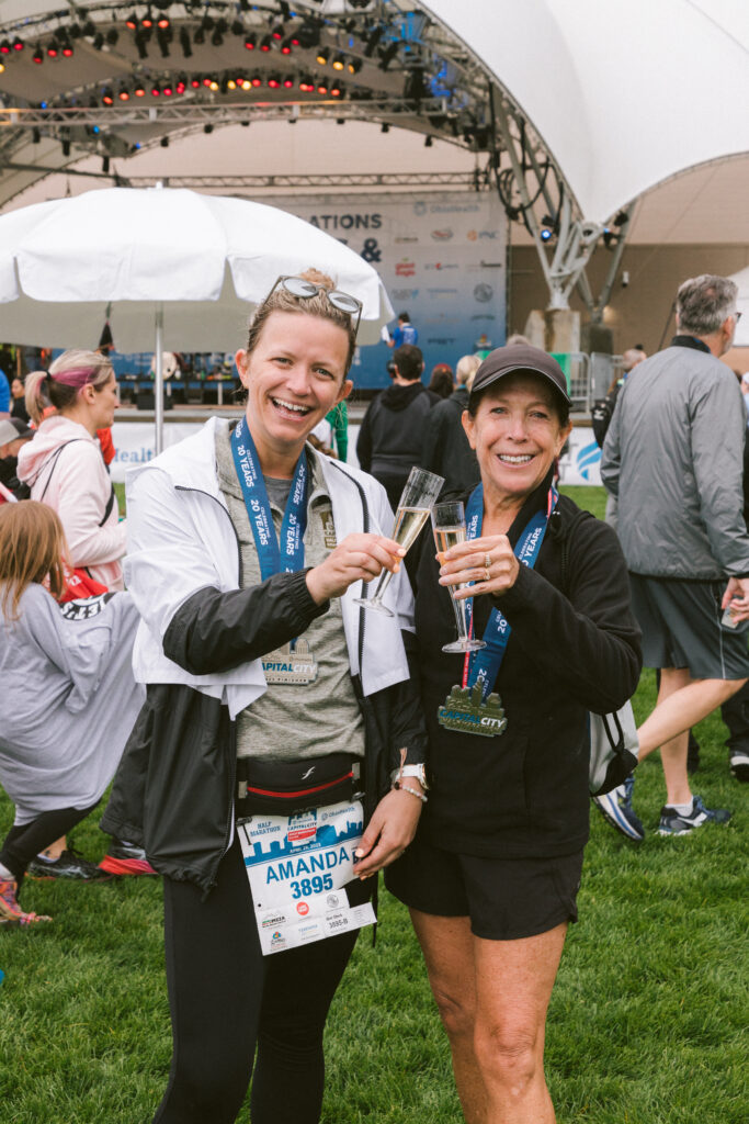 runners with drinks cheers after the marathon